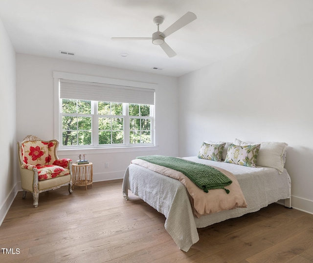 bedroom featuring hardwood / wood-style floors and ceiling fan