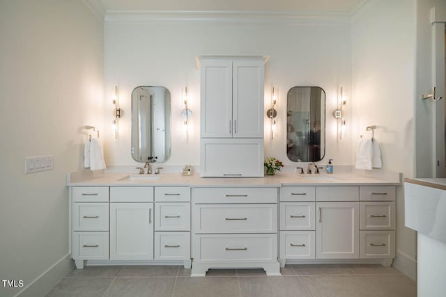 bathroom with vanity, crown molding, and tile patterned flooring