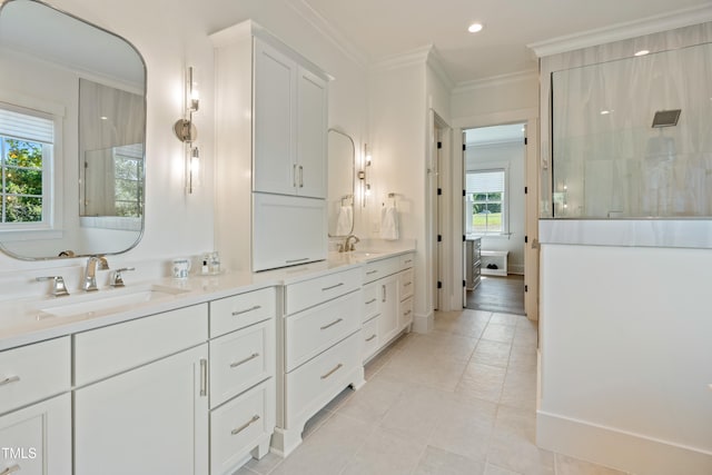 bathroom with vanity, a shower, crown molding, and tile patterned floors