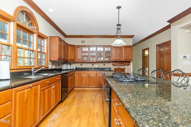 kitchen with stainless steel gas cooktop, crown molding, sink, and light wood-type flooring