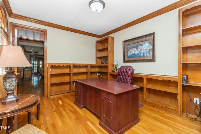 office featuring ornamental molding and light hardwood / wood-style flooring