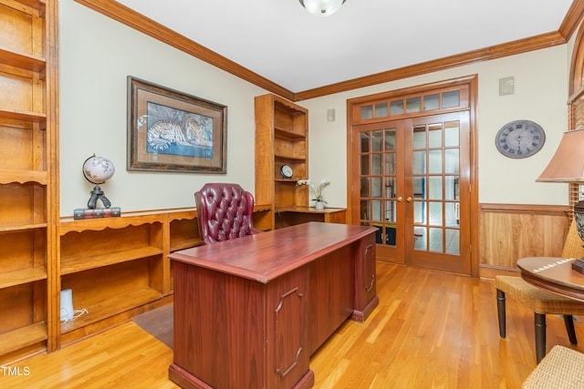 office space with wooden walls, crown molding, light hardwood / wood-style floors, and french doors