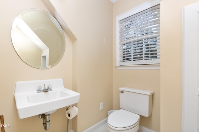 bathroom featuring toilet and sink