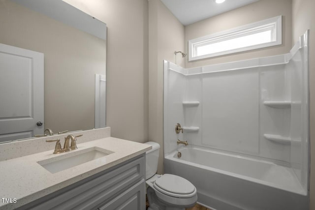 full bathroom with shower / washtub combination, vanity, and toilet