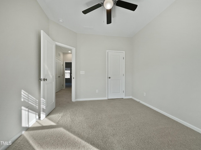 unfurnished bedroom with carpet flooring and ceiling fan