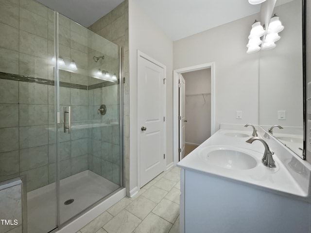 bathroom featuring vanity and an enclosed shower