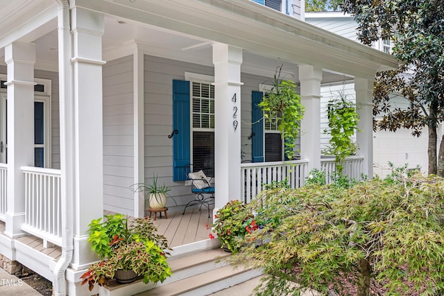 view of exterior entry with a porch