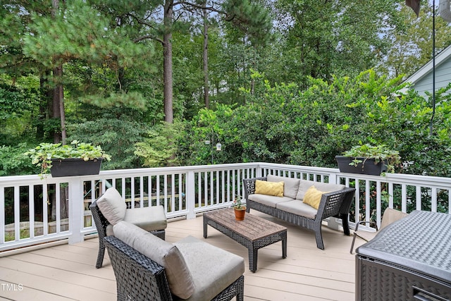 deck featuring outdoor lounge area