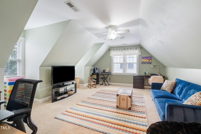 living room with carpet floors, ceiling fan, vaulted ceiling, an office area, and baseboards
