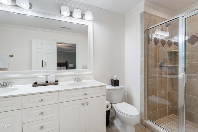 bathroom featuring a shower stall, ensuite bath, toilet, double vanity, and crown molding