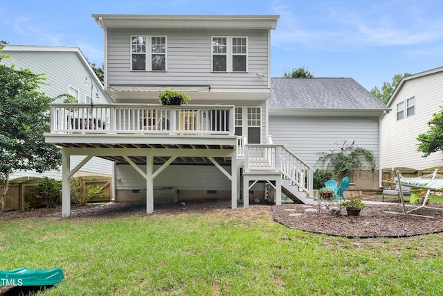 rear view of house with a wooden deck, stairs, roof with shingles, and crawl space