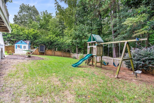 view of jungle gym featuring an outdoor structure and view of scattered trees