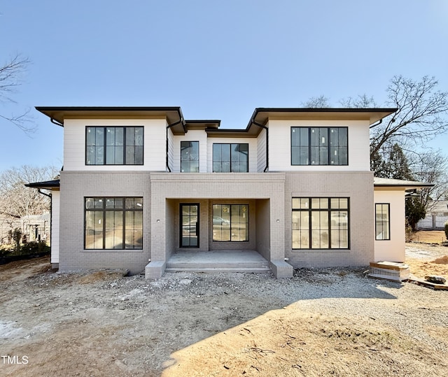 back of property with a patio area