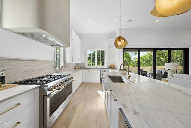 712 Daniels St, Raleigh, NC 27605 - kitchen with a sink, decorative backsplash, double oven range, custom range hood, and light stone countertops