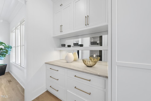 712 Daniels St, Raleigh, NC 27605 - bar with light wood-style floors and baseboards
