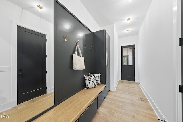 712 Daniels St, Raleigh, NC 27605 - mudroom featuring visible vents, baseboards, and light wood-style floors