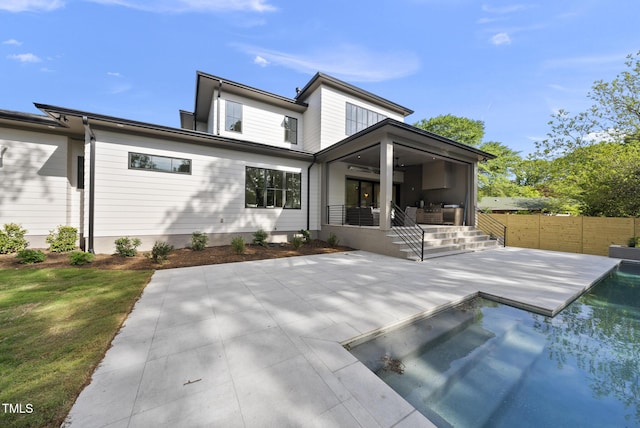 712 Daniels St, Raleigh, NC 27605 - rear view of property with stairway, a patio area, fence, a fenced in pool, and ceiling fan