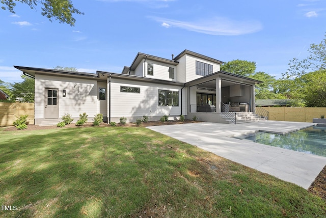 712 Daniels St, Raleigh, NC 27605 - rear view of house featuring a patio area, a fenced in pool, a lawn, a ceiling fan, and fence