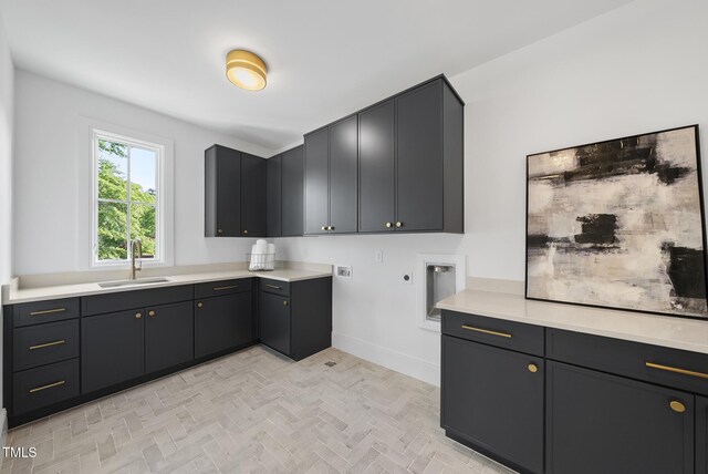 712 Daniels St, Raleigh, NC 27605 - washroom featuring a sink, hookup for a washing machine, baseboards, electric dryer hookup, and cabinet space
