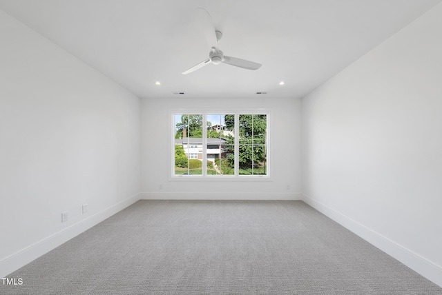 712 Daniels St, Raleigh, NC 27605 - spare room featuring light colored carpet, ceiling fan, and baseboards