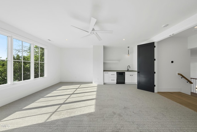 712 Daniels St, Raleigh, NC 27605 - unfurnished living room with baseboards, recessed lighting, ceiling fan, and wet bar