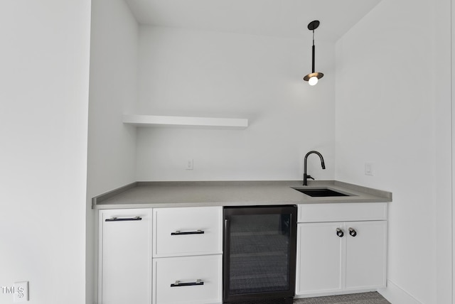 712 Daniels St, Raleigh, NC 27605 - bar featuring indoor wet bar, decorative light fixtures, a sink, and wine cooler