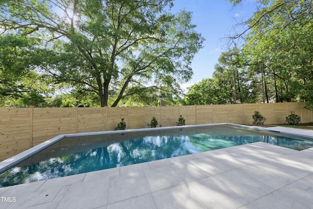712 Daniels St, Raleigh, NC 27605 - view of swimming pool with a fenced in pool, a patio area, and a fenced backyard
