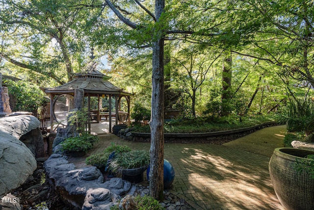 view of yard featuring a gazebo and a patio area