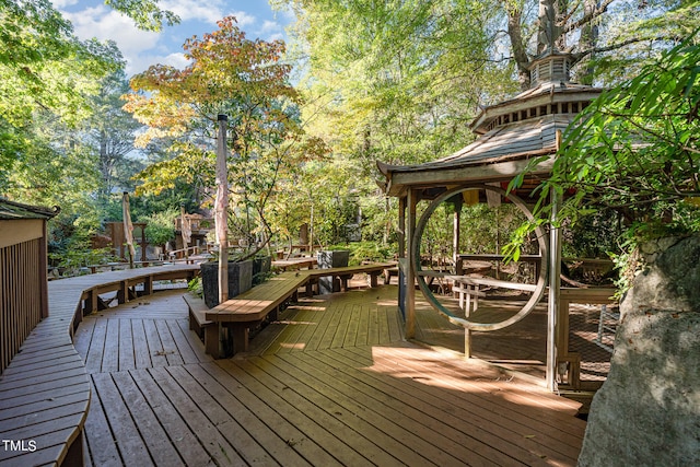 wooden deck featuring a gazebo