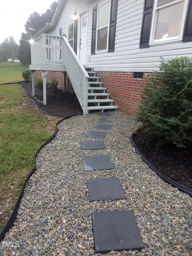 view of side of home featuring a deck