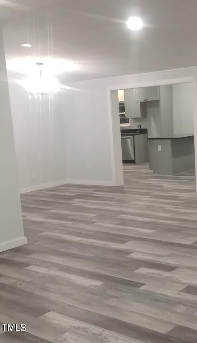 unfurnished room featuring wood-type flooring