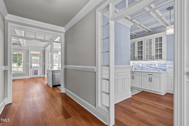 hallway featuring coffered ceiling, hardwood / wood-style flooring, and crown molding