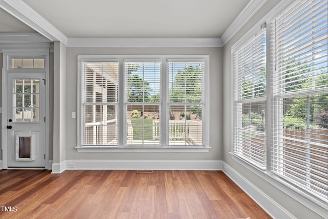 unfurnished sunroom featuring a wealth of natural light