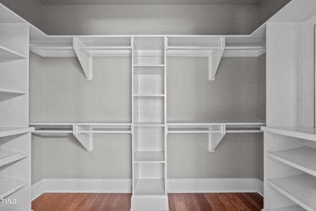 walk in closet featuring hardwood / wood-style floors