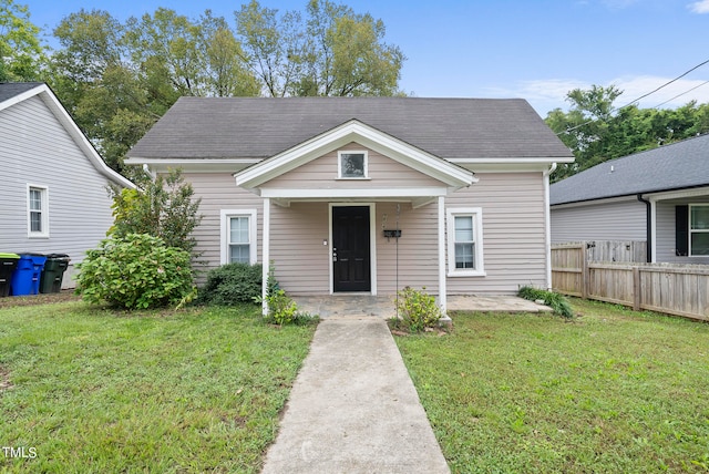 bungalow-style house with a front yard