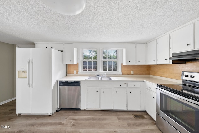 kitchen featuring sink, a textured ceiling, white cabinetry, appliances with stainless steel finishes, and light wood-type flooring