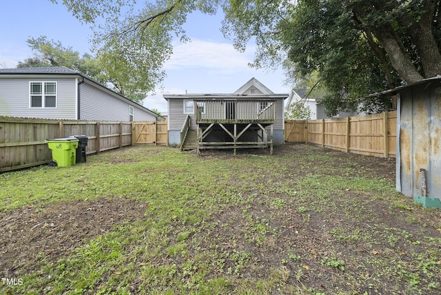 view of yard featuring a fenced backyard and a deck