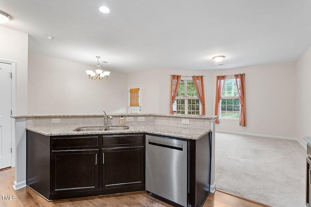 kitchen with dishwasher, light hardwood / wood-style floors, and sink