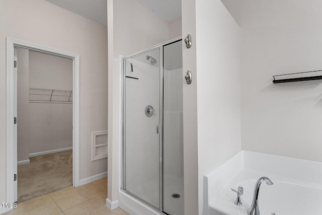 bathroom featuring separate shower and tub and tile patterned floors