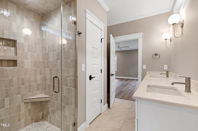 bathroom featuring ornamental molding, a shower with door, and vanity