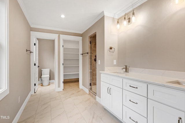 bathroom featuring ornamental molding, a shower with shower door, vanity, and toilet