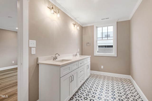 bathroom with vanity and ornamental molding