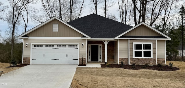 craftsman-style house featuring a garage, stone siding, concrete driveway, and a shingled roof