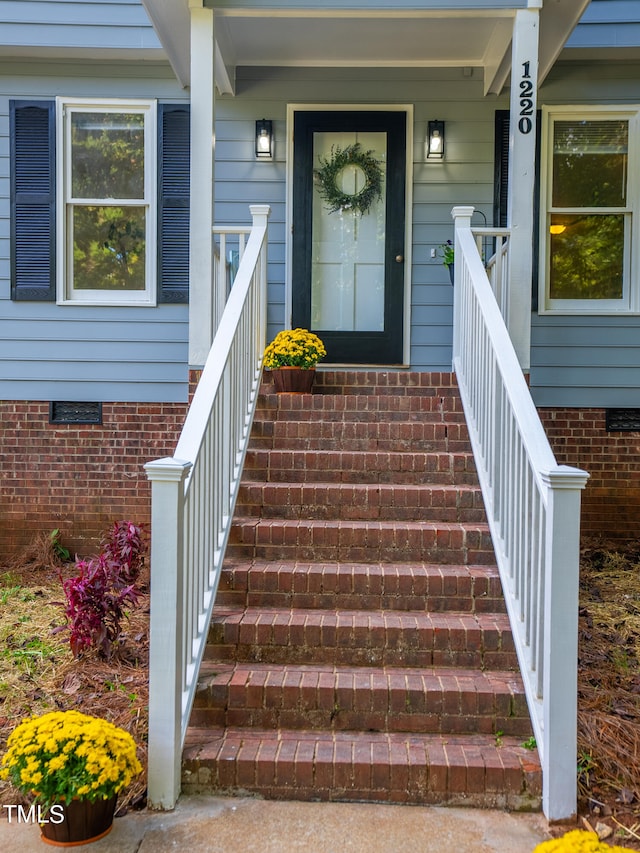 entrance to property with covered porch