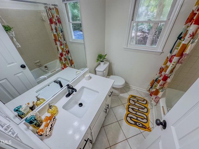 full bathroom featuring plenty of natural light, vanity, shower / bath combination with curtain, and tile patterned floors