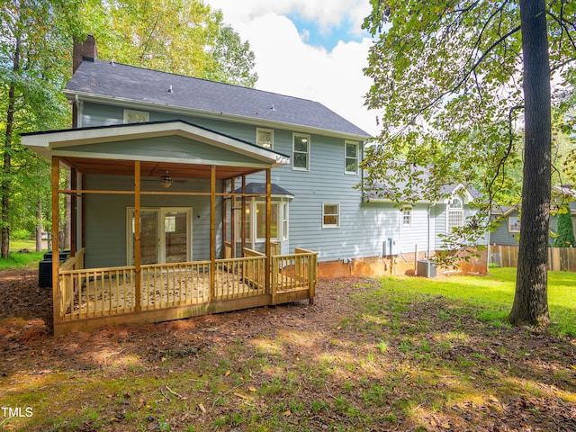 back of property featuring cooling unit, ceiling fan, and a wooden deck