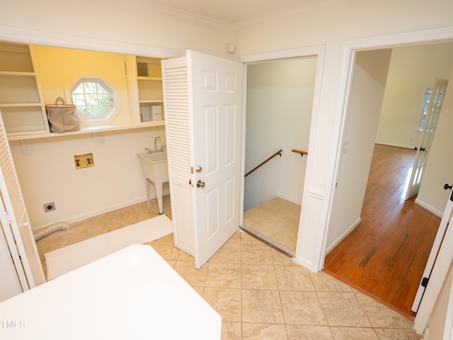 bathroom with hardwood / wood-style floors and ornamental molding