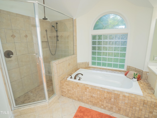 bathroom featuring tile patterned flooring and plus walk in shower