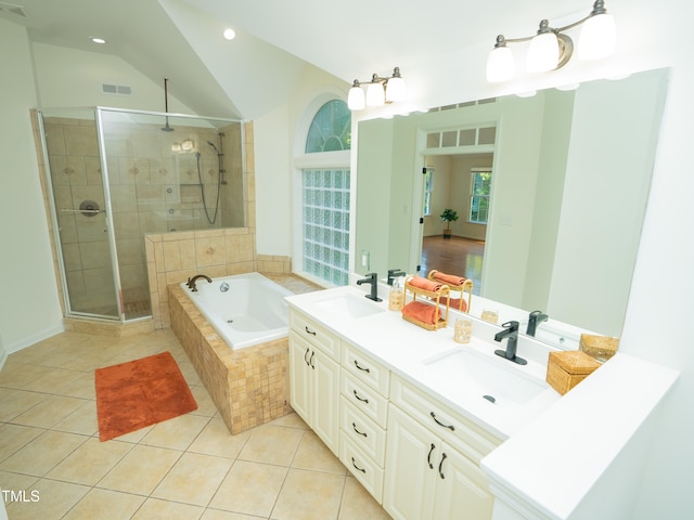 bathroom featuring tile patterned flooring, shower with separate bathtub, lofted ceiling, and vanity