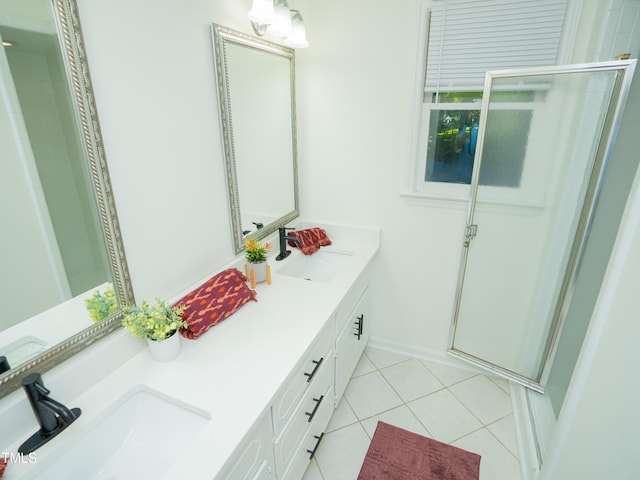 bathroom with vanity, a shower with shower door, and tile patterned flooring